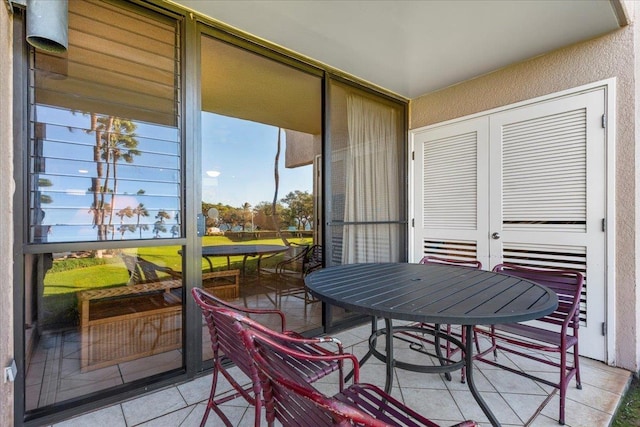 balcony with outdoor dining area