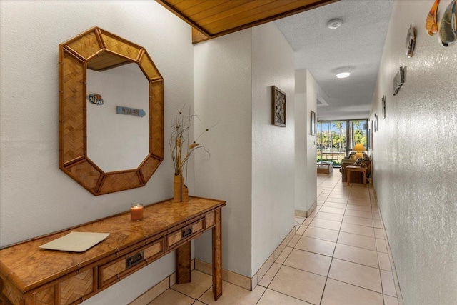 hall featuring light tile patterned flooring