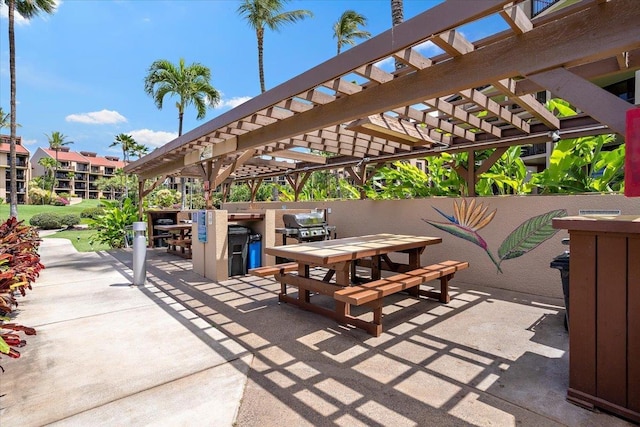view of patio / terrace with a pergola and outdoor dining space