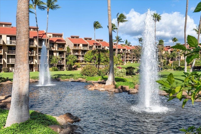 surrounding community featuring a water view