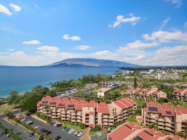 aerial view featuring a water and mountain view