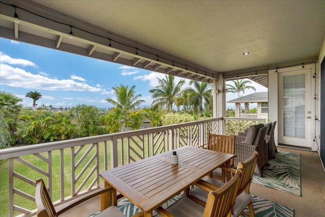 balcony featuring outdoor dining space