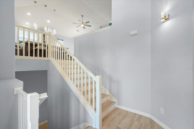 stairs featuring a ceiling fan, recessed lighting, wood finished floors, and baseboards