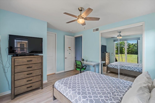 bedroom featuring access to exterior, visible vents, light wood finished floors, ceiling fan, and baseboards