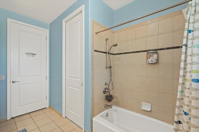 bathroom featuring tile patterned flooring and shower / bathtub combination with curtain