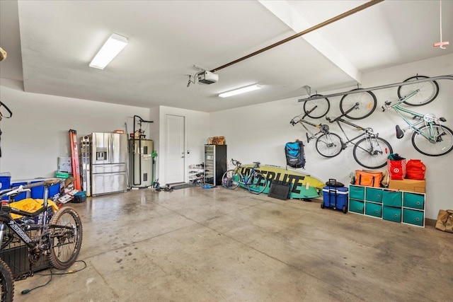 garage featuring a garage door opener, hybrid water heater, and stainless steel refrigerator with ice dispenser