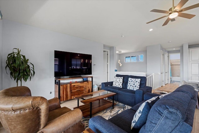 living area featuring a ceiling fan, light wood-style flooring, and recessed lighting