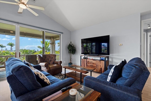 living room with wood finished floors, ceiling fan, and vaulted ceiling