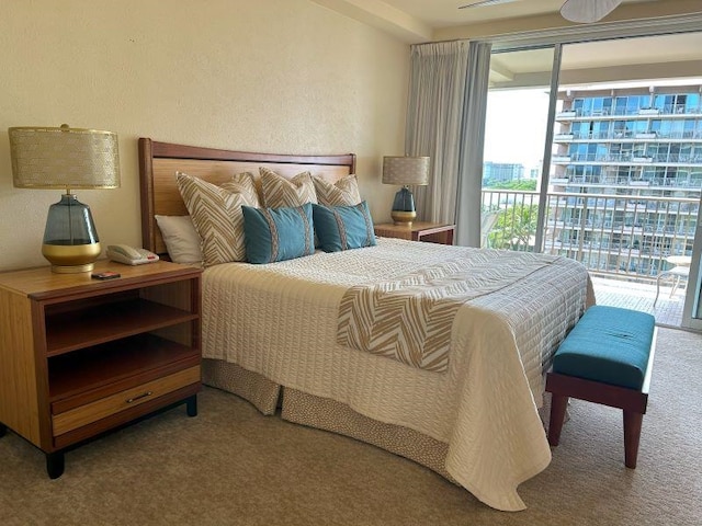 bedroom with access to outside and carpet flooring