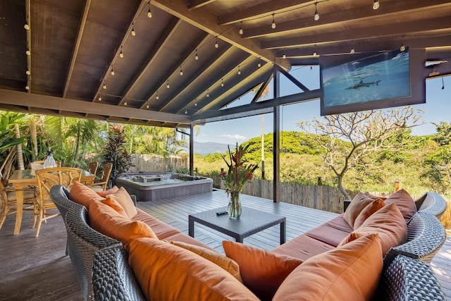 view of patio featuring outdoor lounge area, a deck, and an outdoor hot tub