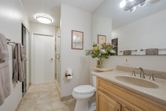 bathroom featuring tile patterned floors, vanity, toilet, and walk in shower