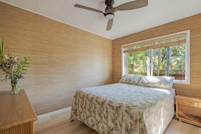 bedroom featuring ceiling fan and light hardwood / wood-style flooring