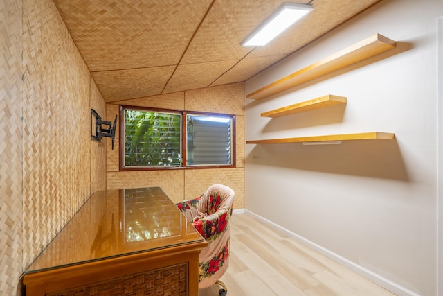 office area featuring vaulted ceiling and hardwood / wood-style flooring