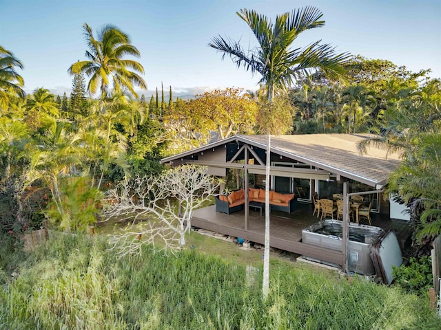 exterior space with outdoor lounge area and a deck