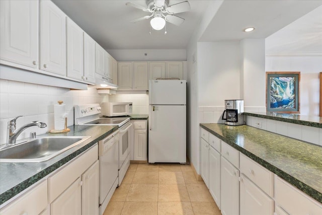 kitchen with white appliances, light tile patterned floors, sink, white cabinets, and ceiling fan