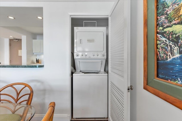 laundry room featuring stacked washer and dryer