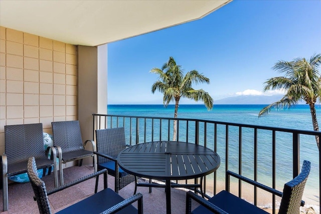 balcony featuring a water view