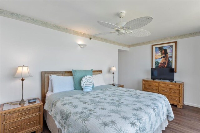 bedroom featuring dark hardwood / wood-style floors and ceiling fan