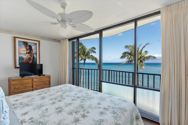 bedroom with access to exterior, a water view, and ceiling fan