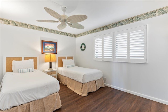 bedroom with dark hardwood / wood-style floors and ceiling fan