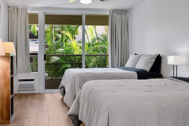 2575 S Kihei Rd Unit P-104, Kihei, HI 96753 - bedroom with wood finished floors and a wall unit AC
