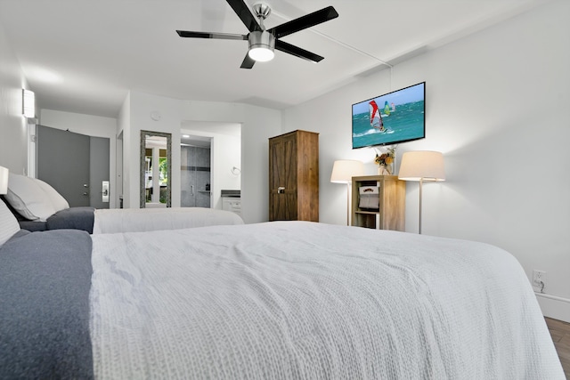 2575 S Kihei Rd Unit P-104, Kihei, HI 96753 - bedroom featuring wood finished floors, a ceiling fan, and baseboards