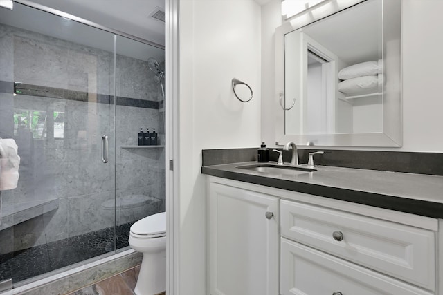 2575 S Kihei Rd Unit P-104, Kihei, HI 96753 - full bathroom with vanity, toilet, a stall shower, and wood finished floors