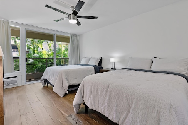 2575 S Kihei Rd Unit P-104, Kihei, HI 96753 - bedroom featuring wood finished floors, ceiling fan, and access to exterior