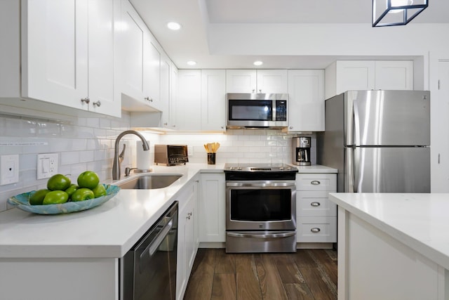 2575 S Kihei Rd Unit P-104, Kihei, HI 96753 - kitchen featuring stainless steel appliances, a sink, recessed lighting, dark wood-style flooring, and white cabinets
