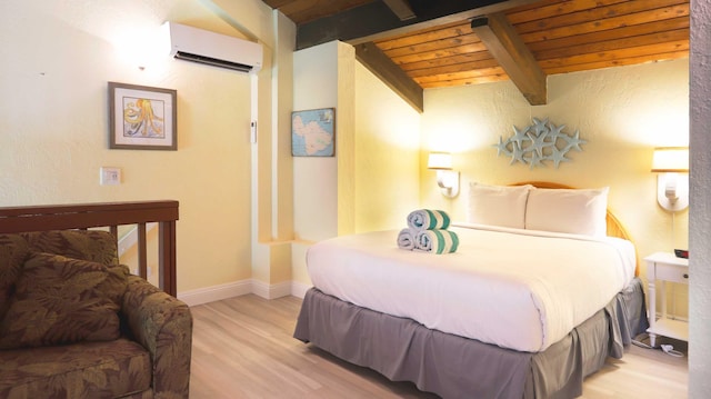 bedroom featuring light hardwood / wood-style floors, a wall unit AC, beamed ceiling, and wooden ceiling