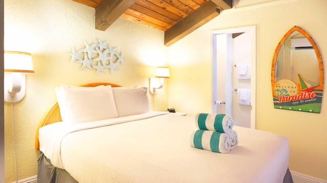 bedroom with wooden ceiling and vaulted ceiling with beams