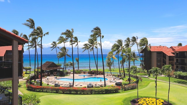 view of swimming pool featuring a gazebo, a water view, and a patio area