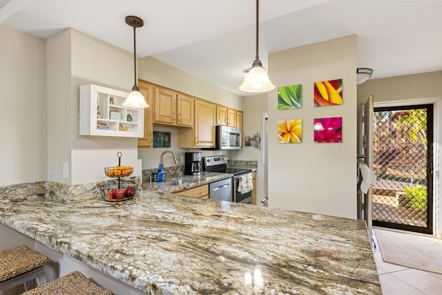 kitchen with pendant lighting, appliances with stainless steel finishes, light brown cabinets, a sink, and a peninsula