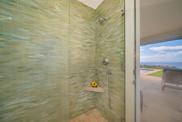 bathroom with a water view and an enclosed shower