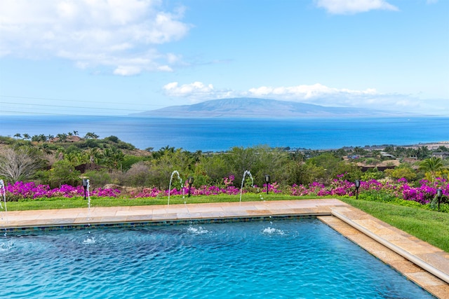 view of pool featuring pool water feature and a water and mountain view