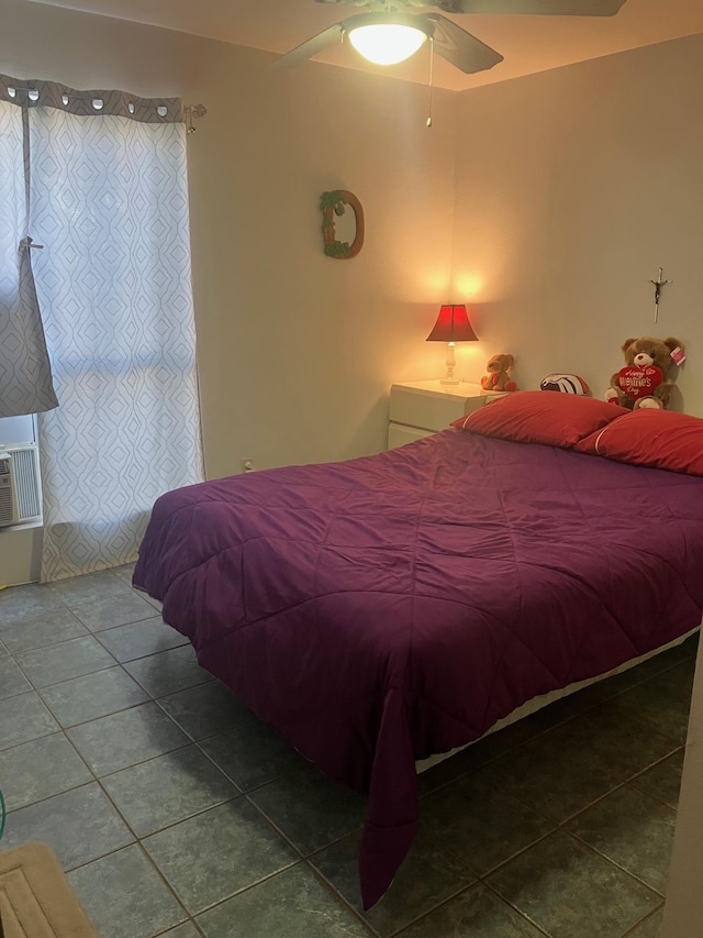 bedroom featuring tile patterned flooring and a ceiling fan