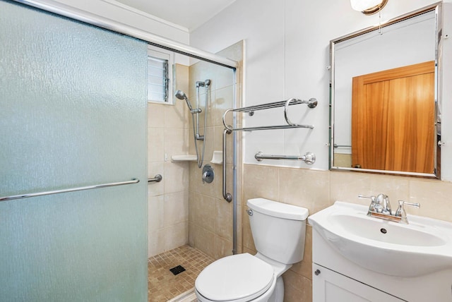 full bath featuring toilet, a shower stall, vanity, and tile walls