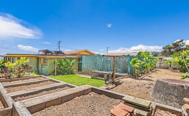 view of yard featuring a garden and fence