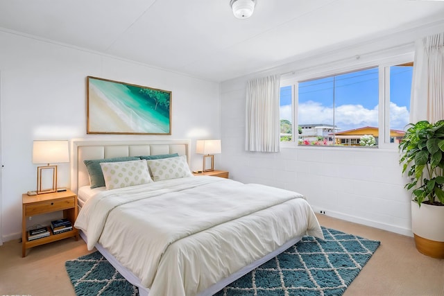 bedroom with concrete block wall