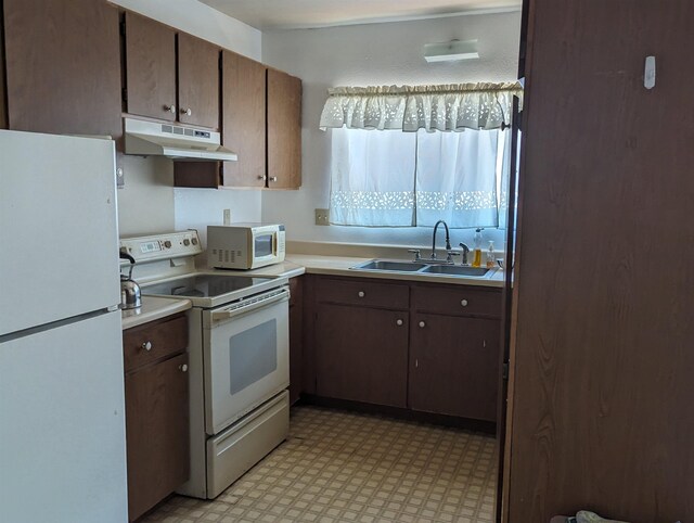 1525 Pakali Pl, Lanai City, HI 96763 - kitchen featuring white appliances, sink, and dark brown cabinets