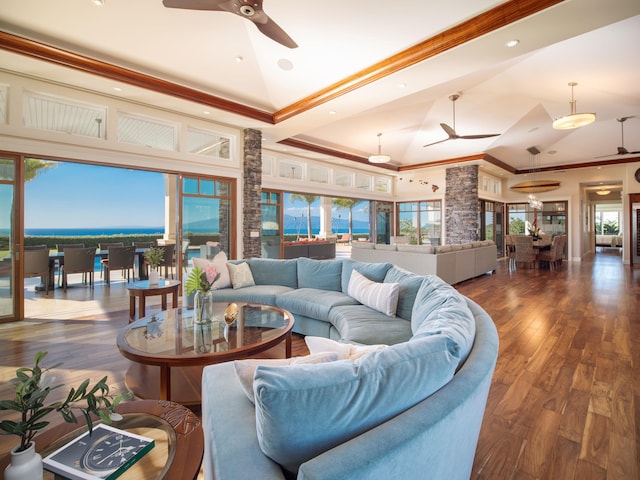 living room with dark hardwood / wood-style flooring, crown molding, ceiling fan, and high vaulted ceiling