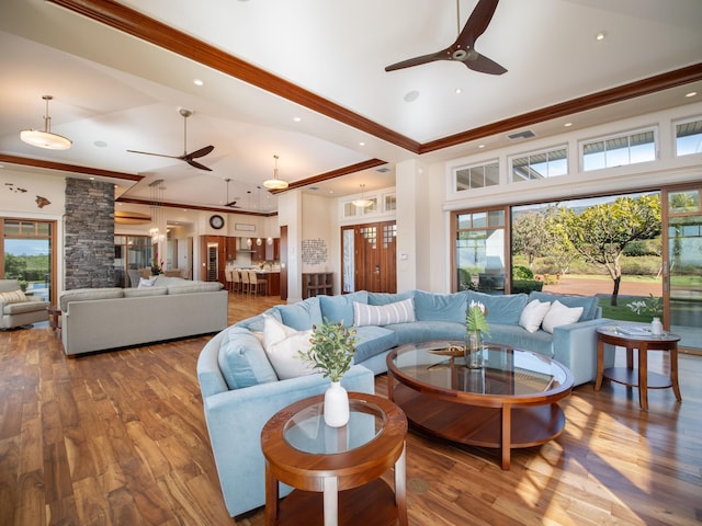 living room featuring ceiling fan, wood-type flooring, and high vaulted ceiling