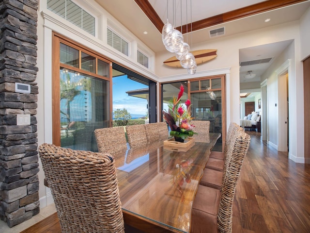 dining area featuring dark wood-type flooring