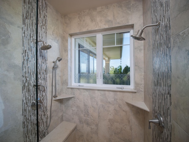 bathroom with tiled shower