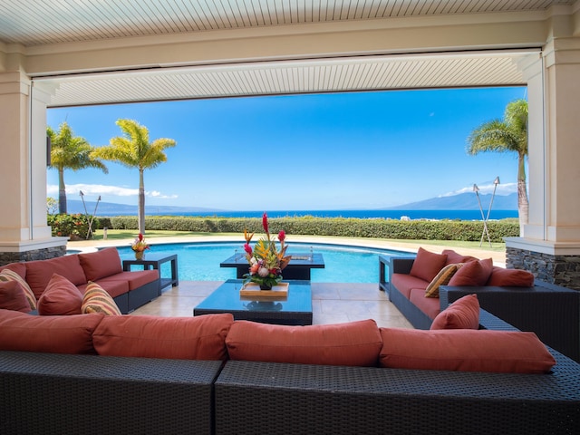 view of swimming pool featuring an outdoor hangout area, a mountain view, and a patio