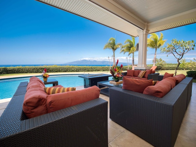 view of patio / terrace featuring a mountain view and outdoor lounge area