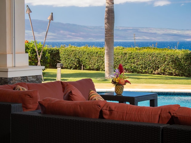 view of patio with a fenced in pool, an outdoor hangout area, and a mountain view