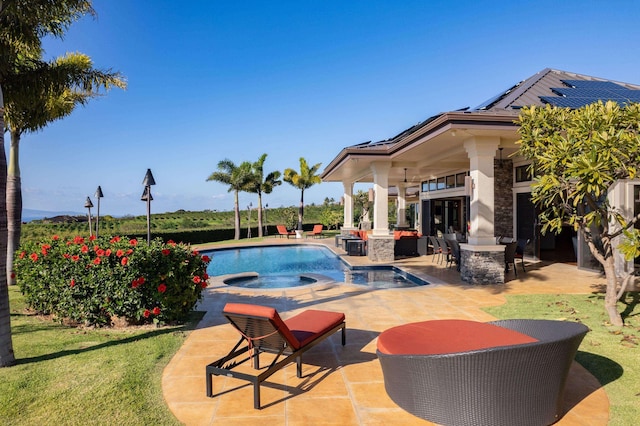 view of swimming pool with an in ground hot tub, a patio, and exterior bar