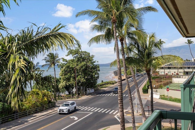 view of road with a water and mountain view