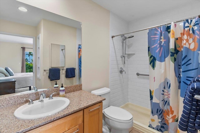 bathroom featuring a shower with curtain, vanity, and toilet